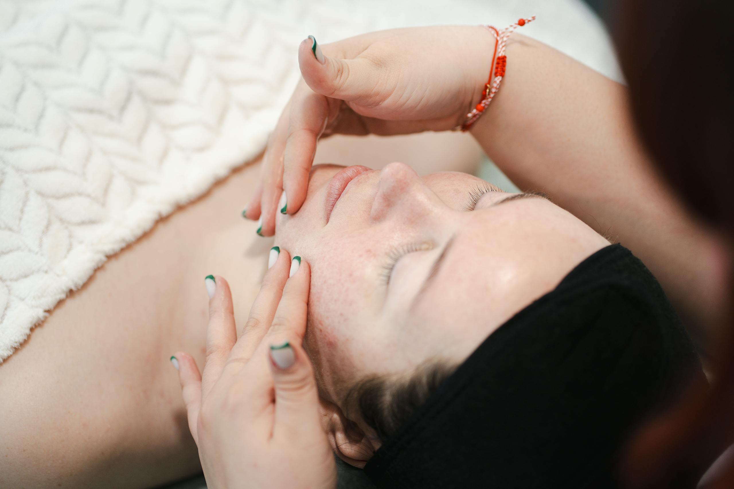 A soothing facial massage session promoting relaxation and skincare in a spa environment.